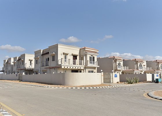 Photo showing construction activity on residential houses or infrastructure in a developed DCK sector.